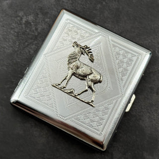 Geometric stag card holder photographed from the front on a dark textured background