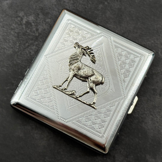 Geometric stag card holder photographed from the front on a dark textured background