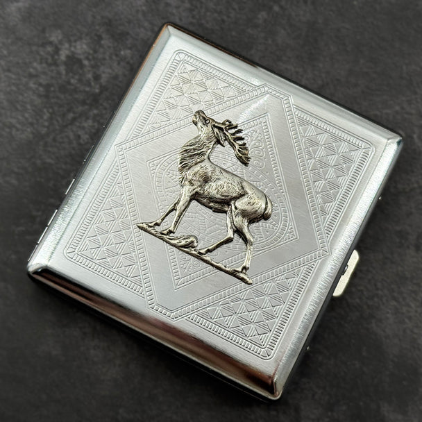 Geometric stag card holder photographed from the front on a dark textured background