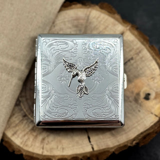 Silver Hummingbird cigarette case featuring raised hummingbird design on engraved metal case