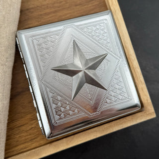 Maritime card holder with silver five-point nautical star and stamped metal pattern