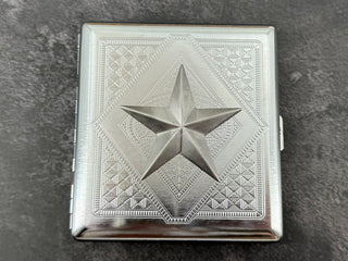 Handmade silver cigarette case featuring a raised nautical star centerpiece