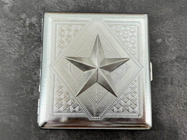 Handmade silver cigarette case featuring a raised nautical star centerpiece
