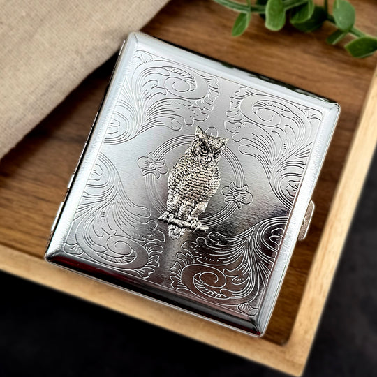 Silver owl metal cigarette case with stamped scrollwork background