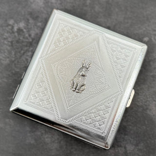 Silver rabbit metal cigarette case with detailed stamped geometric background