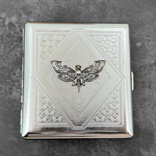 Silver skull hawkmoth metal cigarette case with detailed stamped background