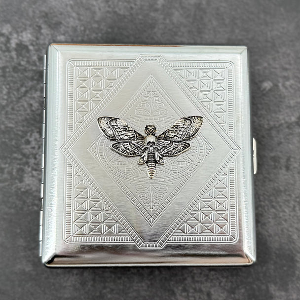 Silver skull hawkmoth metal cigarette case with detailed stamped background