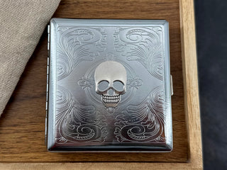 Gothic metal cigarette case with raised silver skull
