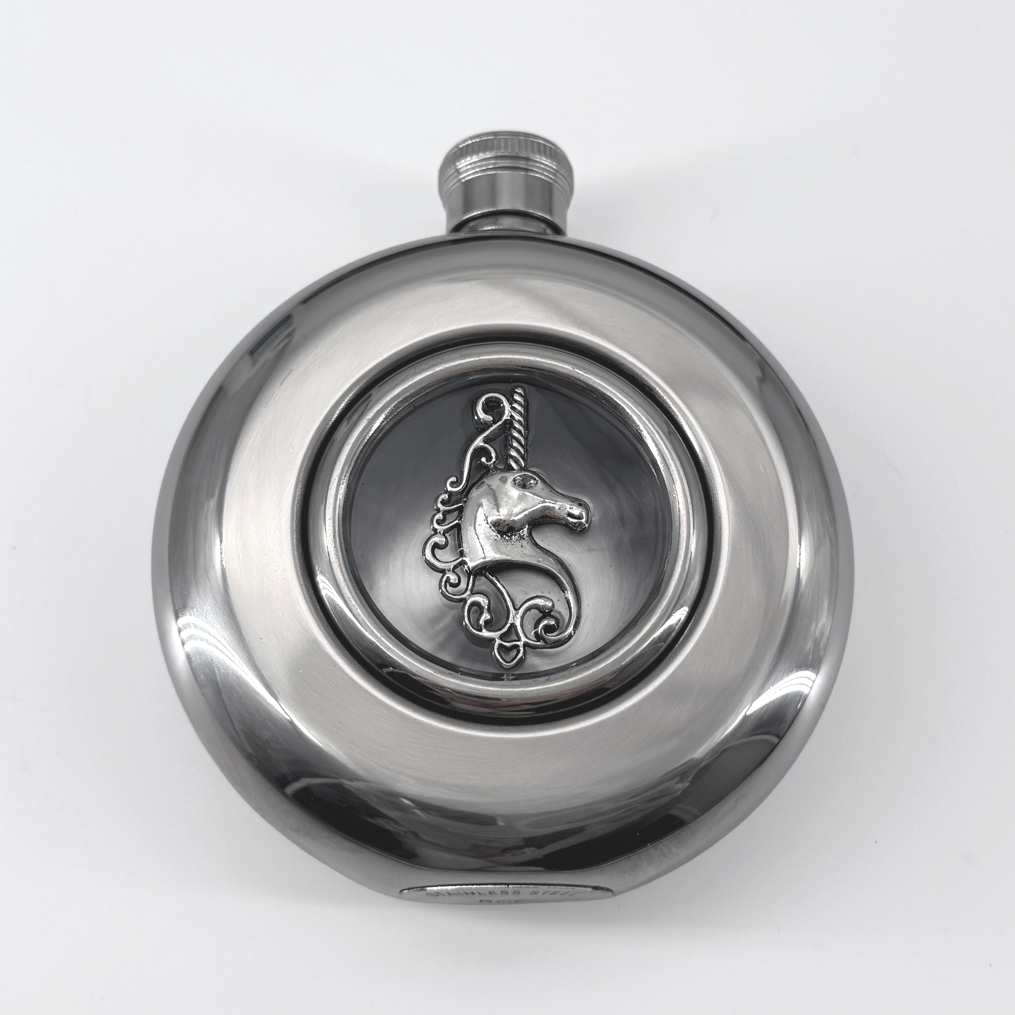 Close-up of raised unicorn detail centered in the transparent flask window