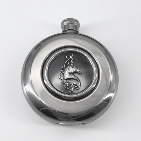 Close-up of raised unicorn detail centered in the transparent flask window