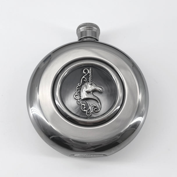 Close-up of raised unicorn detail centered in the transparent flask window