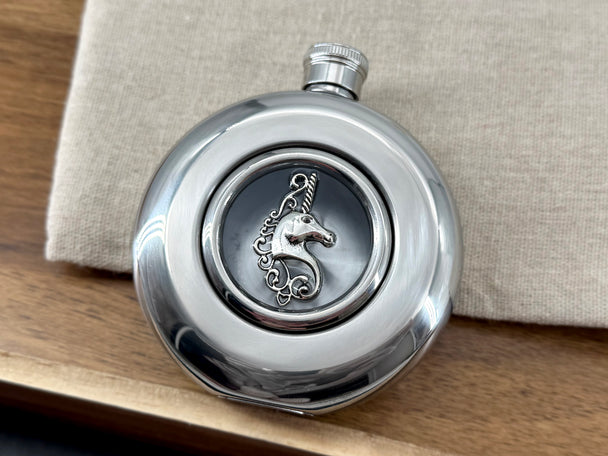 Front view of round unicorn flask with mirror finish and screw-top lid