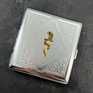 Handmade stamped metal snake case featuring geometric pattern and serpent wrapped around dagger