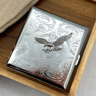 Ornate metal card holder with flying eagle embellishment