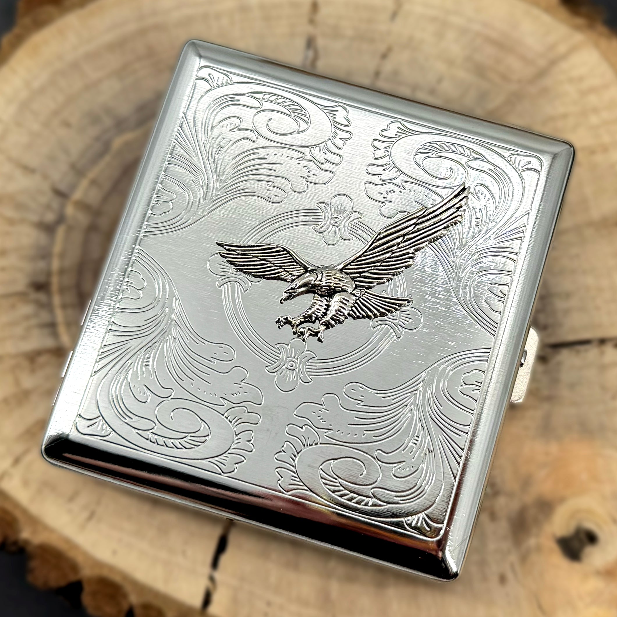 Compact silver case with detailed eagle centerpiece