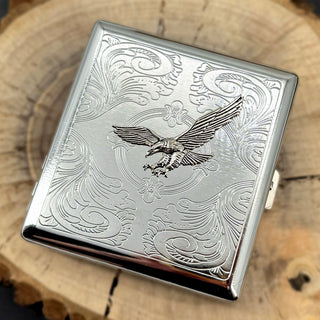 Compact silver case with detailed eagle centerpiece