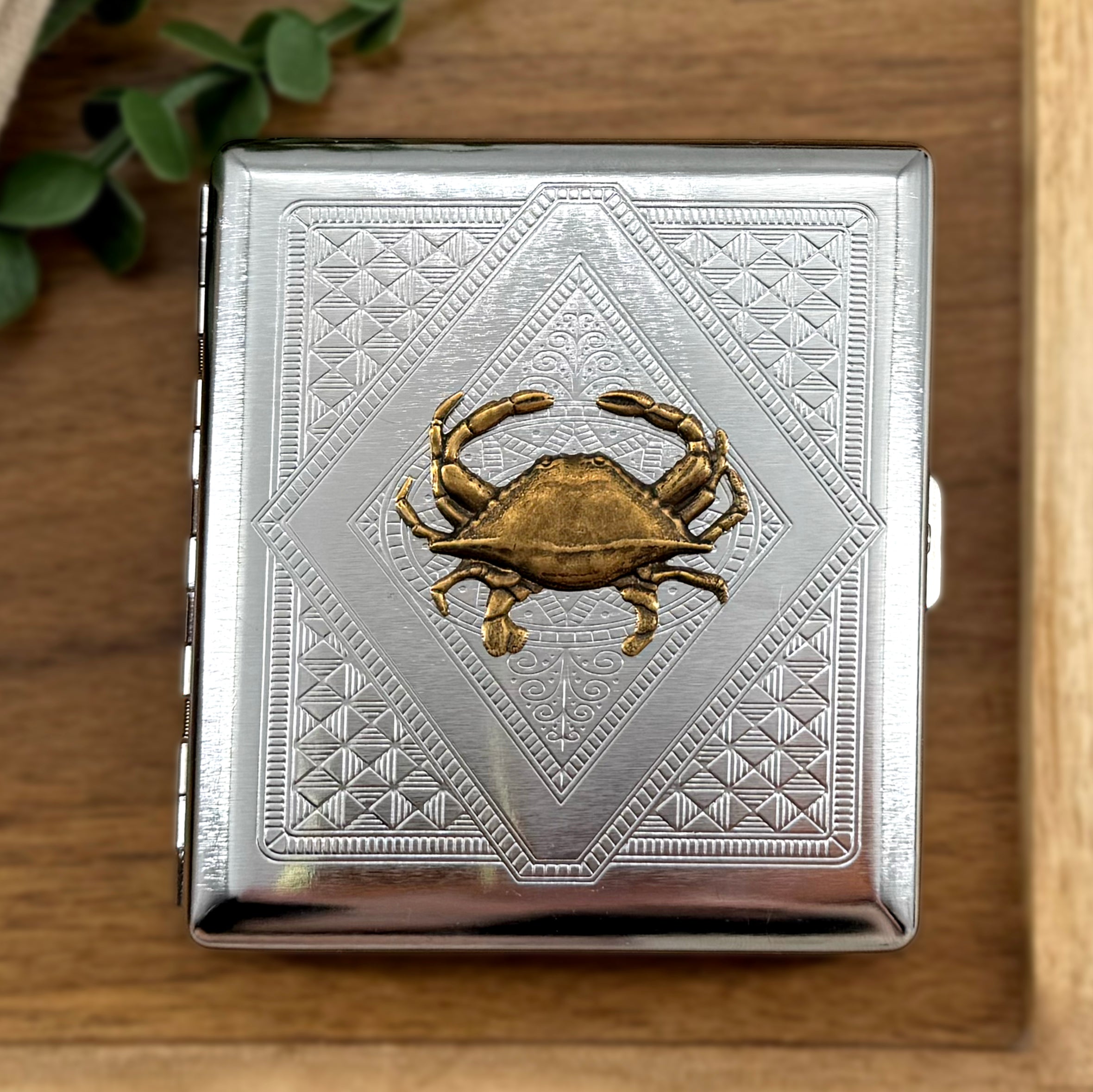 Cancer zodiac inspired crab cigarette case closed front view with polished silver finish