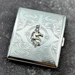 Silver pocket case featuring unicorn crest and ornate stamped pattern