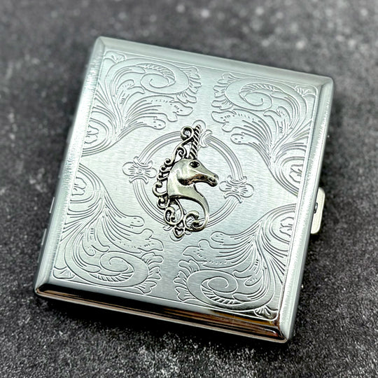 Silver pocket case featuring unicorn crest and ornate stamped pattern