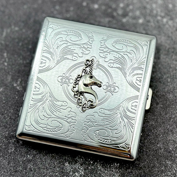 Silver pocket case featuring unicorn crest and ornate stamped pattern