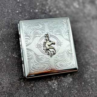 Fantasy card holder with raised unicorn emblem and polished metal finish