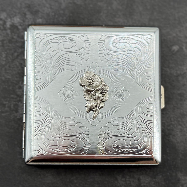 Compact silver cigarette case showcasing an elegant textured stamping with vintage-inspired detailing
