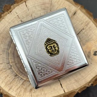 Handmade stamped metal Buddha case featuring geometric pattern and raised Buddha centerpiece