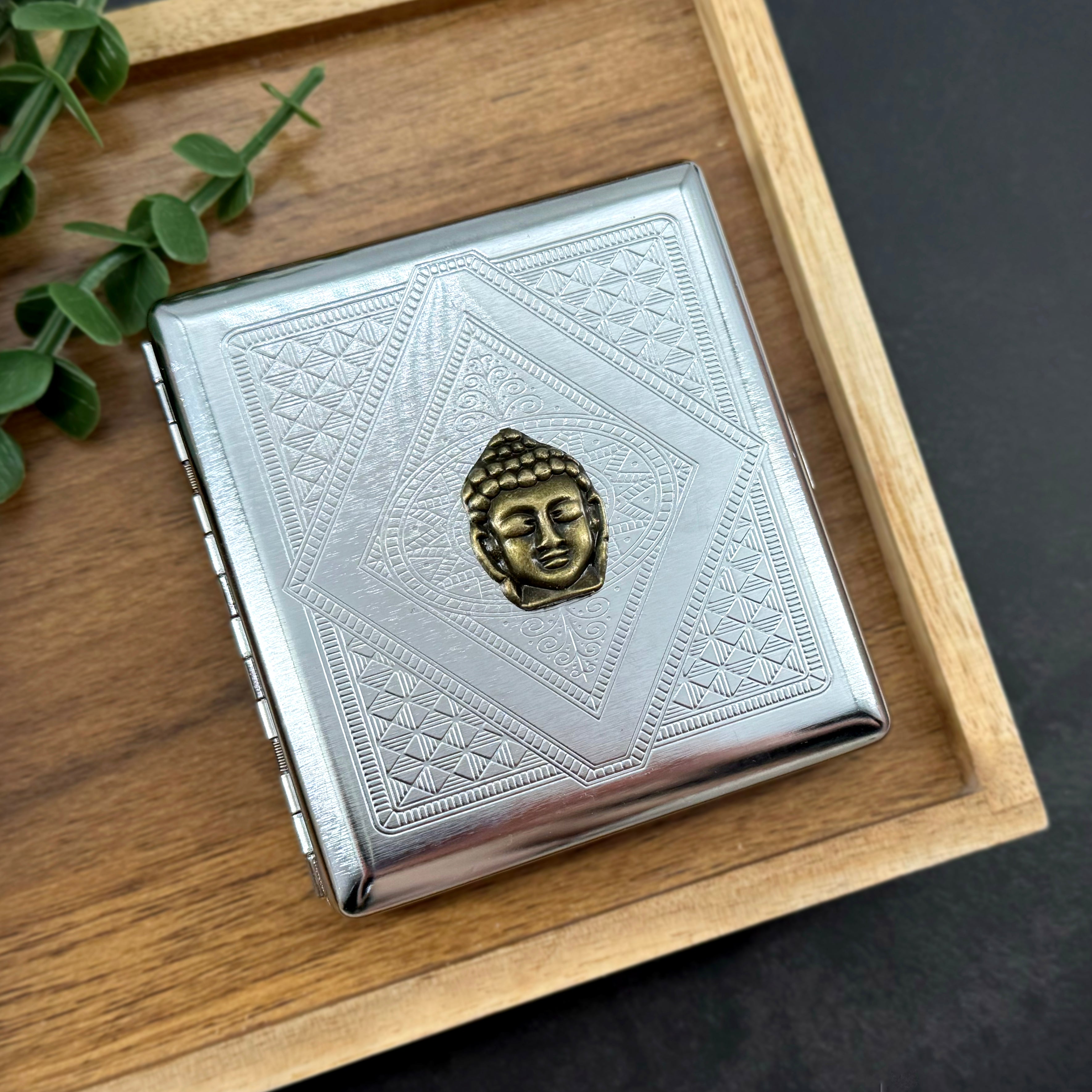 Zen-inspired Buddha cigarette case closed front view with polished silver finish