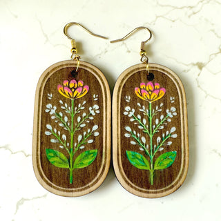 Wildflower wooden earrings with hand-painted floral design by Harmless Habit Studio