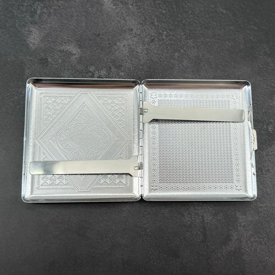 Open stag cigarette case showing two interior metal retaining arms