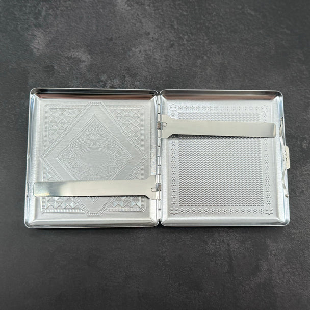 Open stag cigarette case showing two interior metal retaining arms